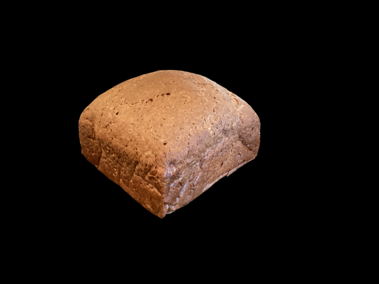 Half loaf of dark pumpernickel rice bread