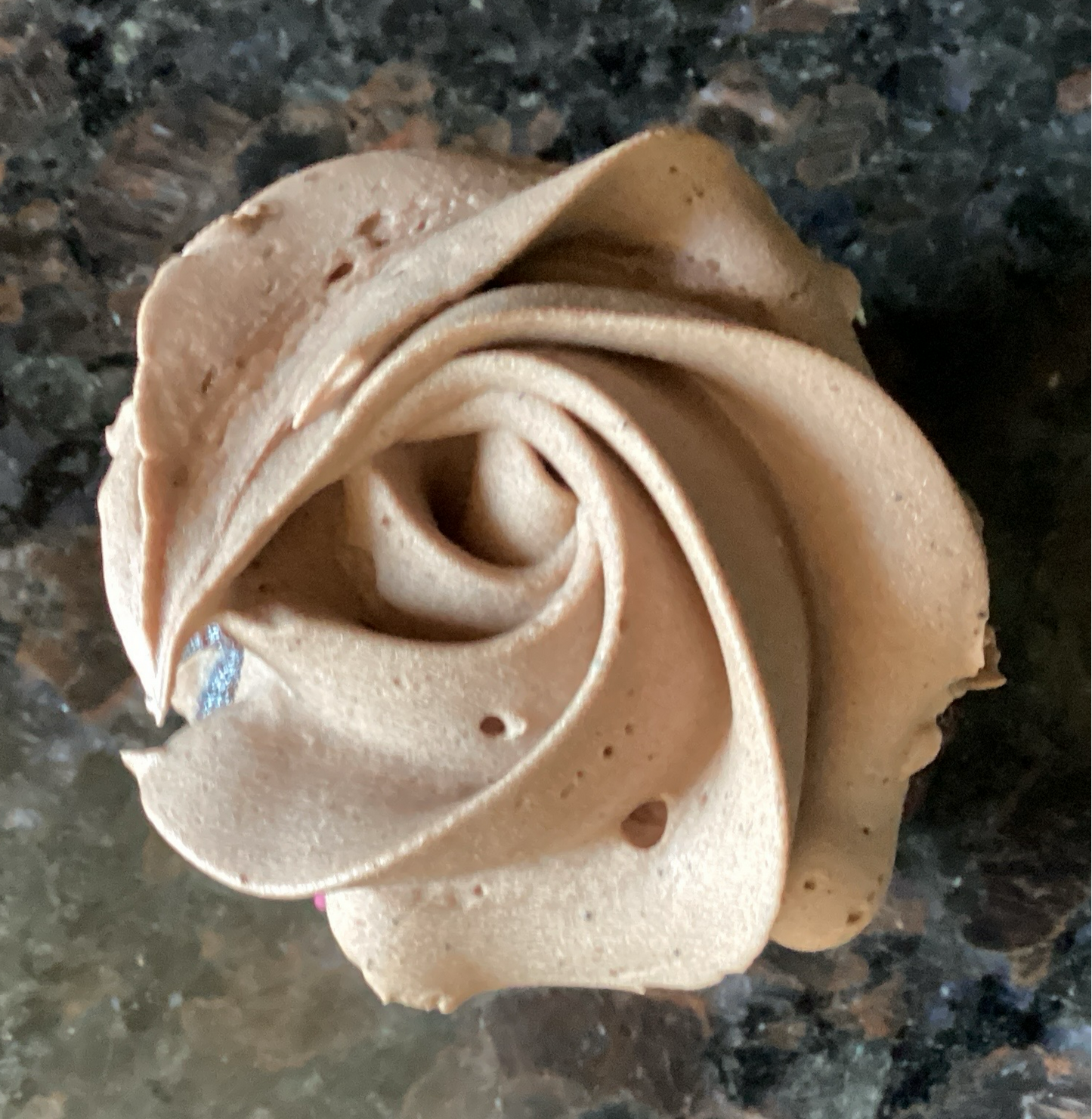 Mini chocolate cupcake with chocolate buttercream frosting