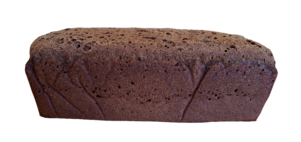 Full sized loaf of dark pumpernickel rice bread
